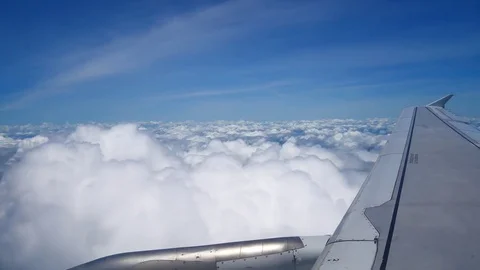 A view from the airplane window over the wings and engines. The planes are fl Stock Footage 80106359