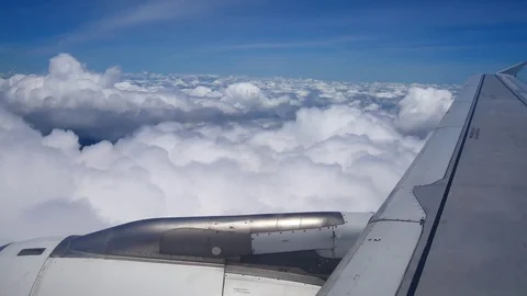 A view from the airplane window over the wings and engines. The planes are fl Stock Footage 80106432
