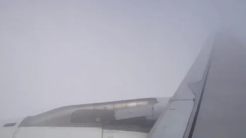 A view from the airplane window over the wings and engines. The planes are fl Stock Footage 80106649