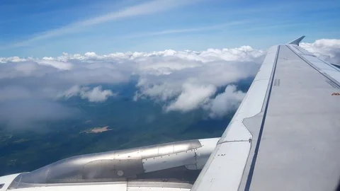 A view from the airplane window over the wings and engines. The planes are fl Stock Footage 80106963