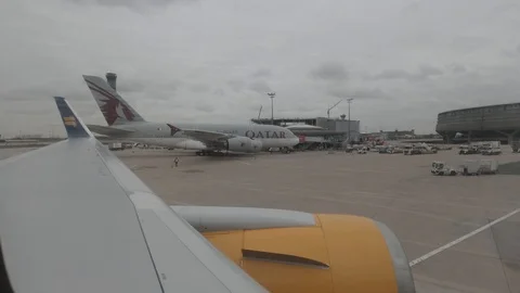 View from Airplane Window in Paris Terminal D Stock Footage 130136377