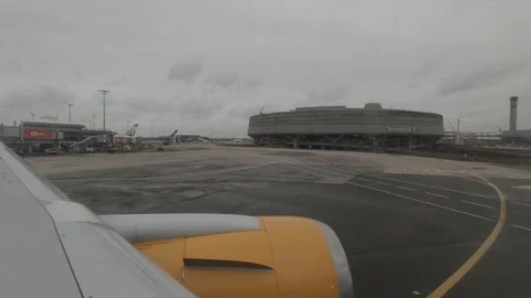View from Airplane Window in Paris Terminal D Stock Footage 130136431