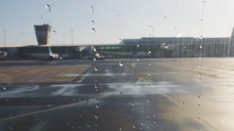View from the airplane window of the runway, planes and airport in Warsaw. 動画素材 308189792