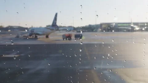 View from the airplane window of the runway, planes and airport in Warsaw. Stock Footage 308190334