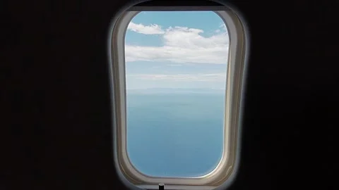 View from the airplane window on the serene blue sea Stock-Footage 337054190