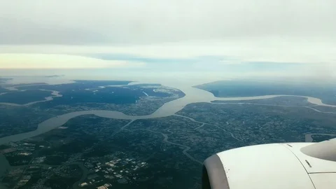 View from an airplane window on a sunny blue sky over vietnam Stock Footage 74955165