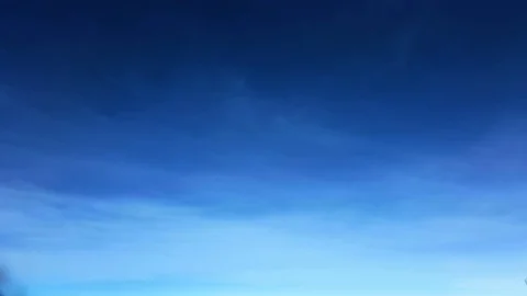 View from an airplane window on a sunny with smooth blue sky Stock Footage 74951685