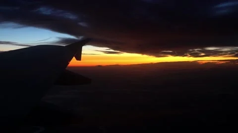 View from the airplane window at sunset Stock Footage 147257558