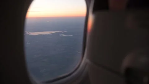 View from the airplane window at sunset. Video stock 183266808