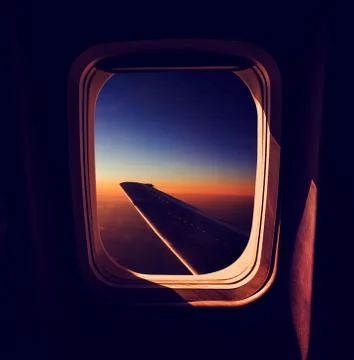 View from Airplane Window at Sunset Stock Photos