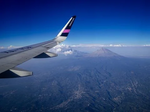 View from the airplane window on the volcano Stock Photos