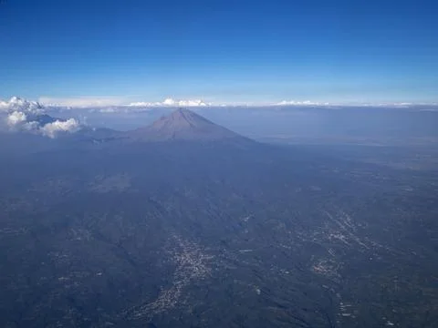 View from the airplane window on the volcano Stock Photos