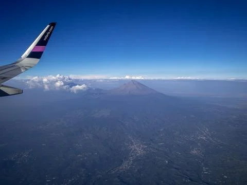 View from the airplane window on the volcano Stock Photos