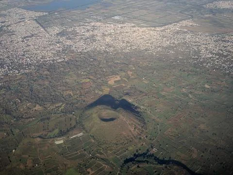 View from the airplane window on the volcano Stock Photos