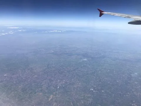 View from an airplane window when up in the sky Stock Photos