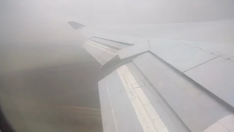 View From Airplane Window Of Wing After Takeoff Rain Left To Right Vídeo Stock 102501480