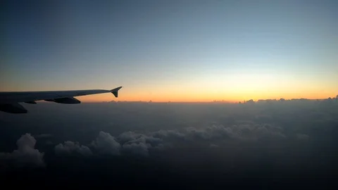 View from airplane window. The Wing Of An Airplane Looking Through The Passenger Stock-Footage 103670071