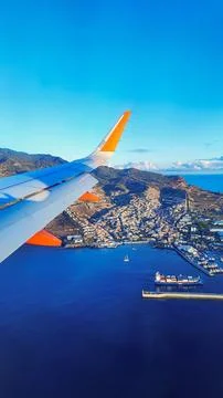 View from the airplane window on the wing and the island of Madeira, Portug.. Stock Photos
