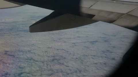 View From Airplane Window Of Wing Close Up Above Clouds Left To Right Stock Footage 102501586