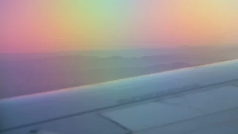 View From Airplane Window Of Wing Mountains In Distance Focused Stock-Footage 102501883