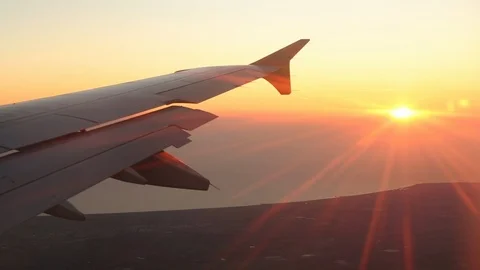 View From Airplane Window Of Wing Sunset Into Sun Right To Left 스톡 동영상 102502162
