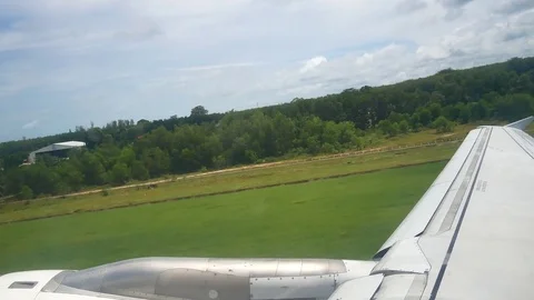 A view from the airplane windowafter take off  over the wings and engines. Th Видео 80105426