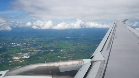 A view from the airplane windowafter take off  over the wings and engines. Th Stock Footage 80107216