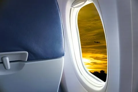 View From Airplane Window,view Sunset or azure sky and clouds from window of  Stock Photos