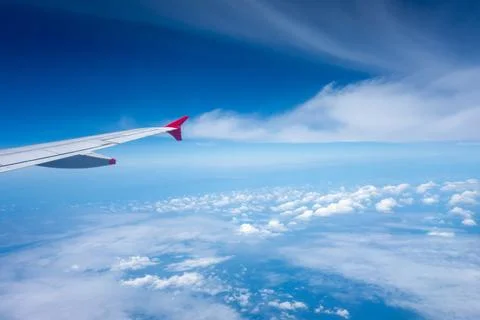 View from an airplane wing above the clouds Foto stock