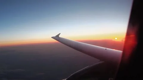 View of an airplane wing and clouds in flight Stock Footage 152978073