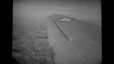View of airplane wing and landscape Stock Footage