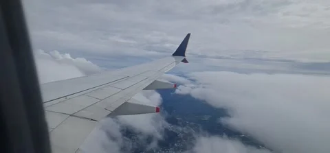 View from an airplane of a wing in clouds 動画素材 212792916