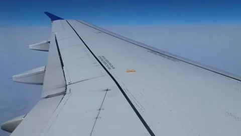 View from airplane wing on a cloudy day Stock Footage 236428891