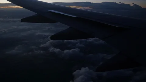 View airplane wing. flying at evening with twilight sky. Stock Footage 92927675