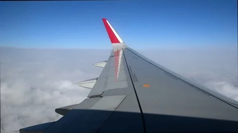 View at the airplane wing over the clouds Stock Footage 73183098