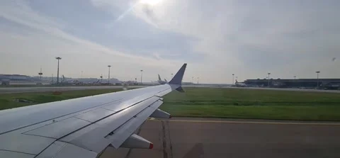View from an airplane of a wing, taking off from runway 動画素材 212793243
