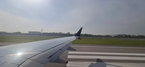 View from an airplane of a wing, taking off from runway 動画素材 212793530