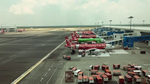 View of airport crew working outside the Malaysian airport KLIA2 Stock Footage 74259689