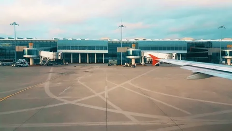 View of the airport from the plane window early in the morning Stock Footage 104410311