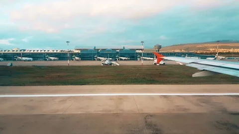 View of the airport from the plane window early in the morning Stock Footage 104410859