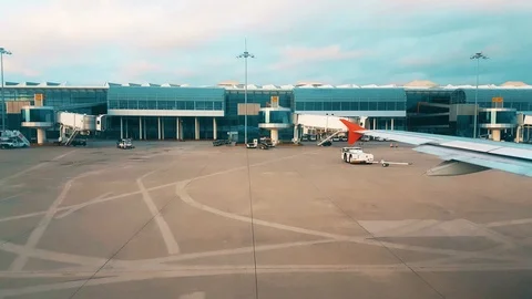 View of the airport from the plane window early in the morning Stock Footage 104411263