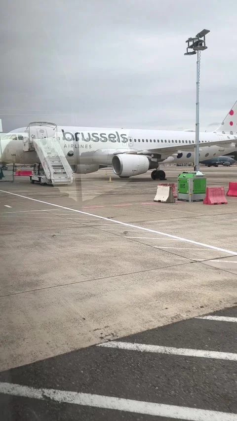 View from airport shuttle bus to planes at Brussels Airport, Belgium Stock Footage 340562118