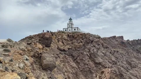 View of Akrotiri Lighthouse and cliffs in Santorini Stock Footage 241756574