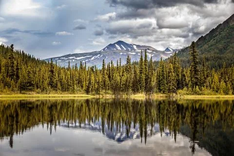 View of Alaskan Mountain Range reflecting in a lake ,Denali National Park, Al Stock Photos