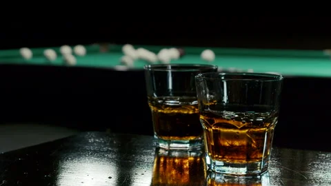View Of Alcoholic Drink In The Background Billiard's Balls Stock Footage 147875894