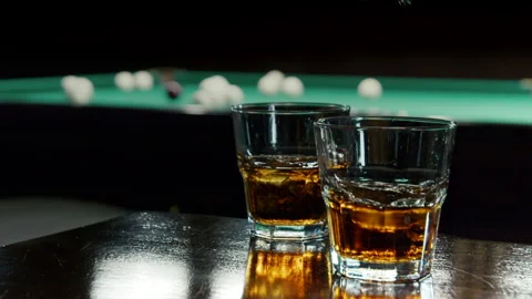 View Of Alcoholic Drink In The Background Billiard's Balls Stock Footage 147876135