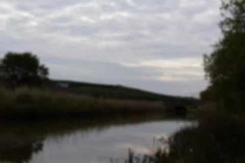 View along the canal path at Bude, Cornwall Out of focus. Stock Photos
