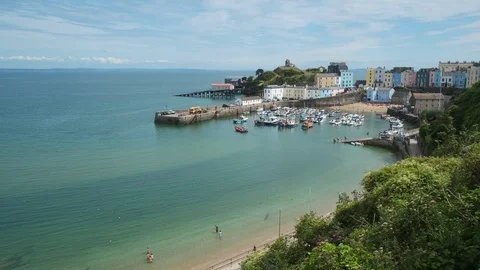 A view along North Beach, towards Tenby harbour Tenby Pembrokeshire Wales Stock Footage 114359160