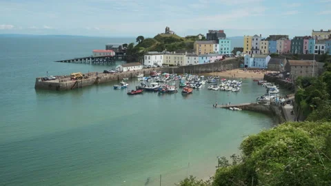A view along North Beach, towards Tenby harbour in the background Stock Footage 130860232