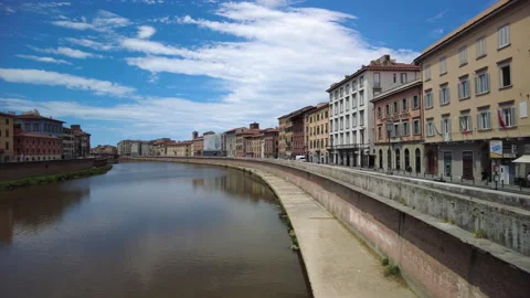 A view along the River Arno flowing through the centre of Pisa, Tuscany Stock Footage 157823610